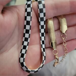 checker board print gold tone snake chain necklace